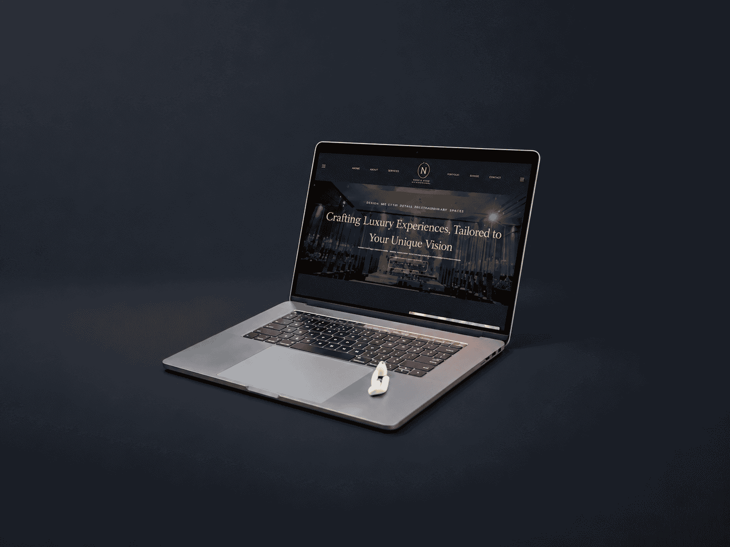 Laptop displaying Earid website with luxury experience theme.